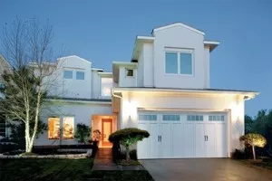 all white house with white courtyard garage doors